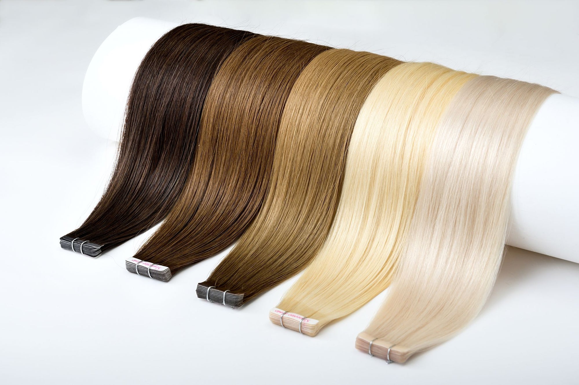 What causes human hair extensions to vary in quality?