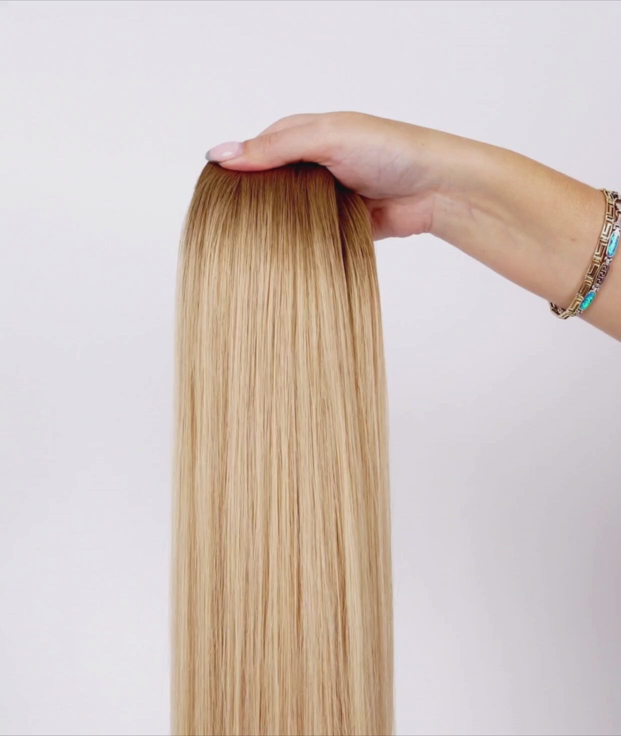 Load video: #Rooted Beach Blonde Seamless Tape In Extensions (NEW)